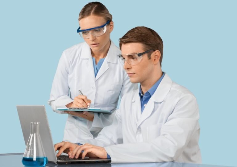 Two laboratory professionals reviewing blood gas results