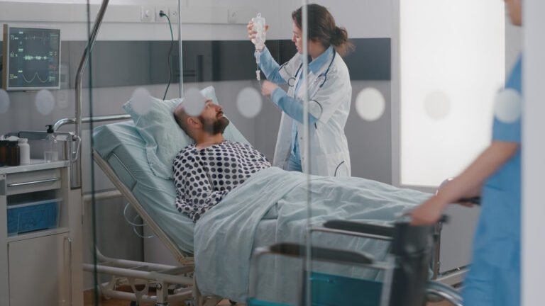 Hospital care team monitoring a patient in the ICU