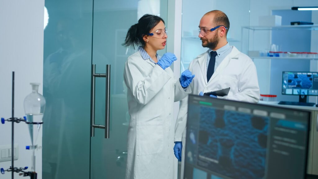 Laboratory team working at their bench with a tablet