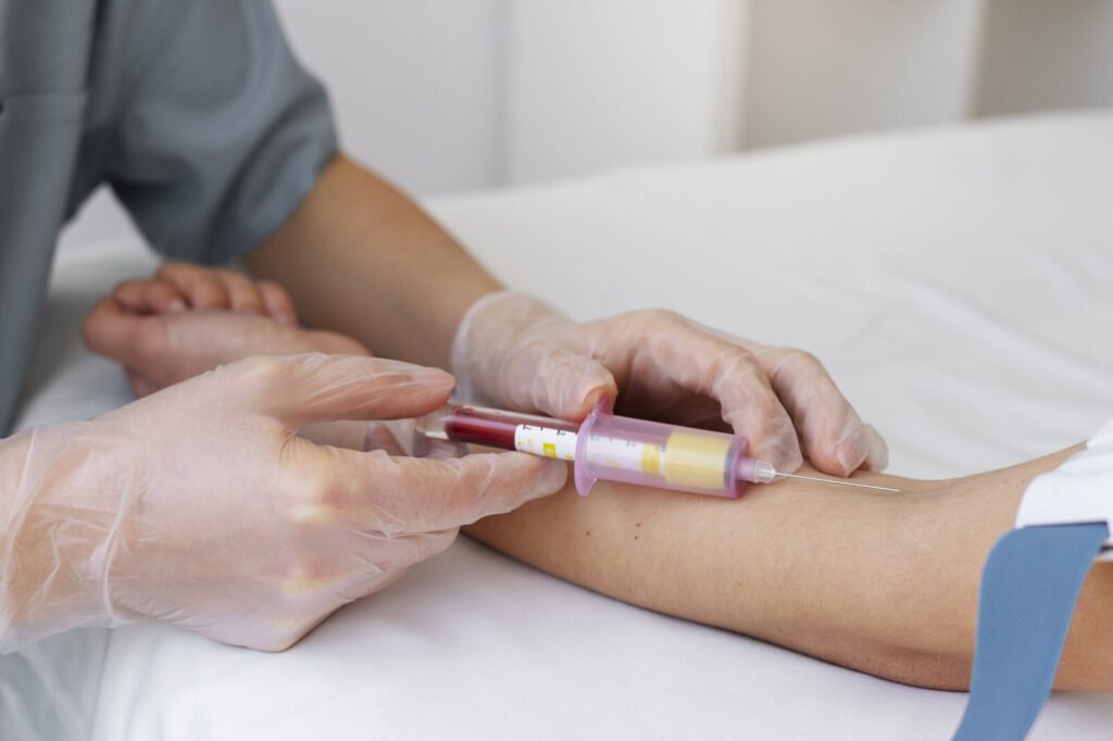 Healthcare professional drawing a blood sample for coagulation testing